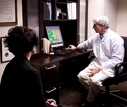 Doctor Marks and team member looking at schedule