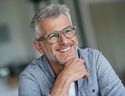 older man smiling after seeing cosmetic dentist in State College