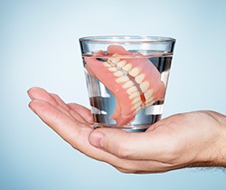 Full dentures in glass of water