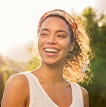 Woman smiling after myofunctional therapy