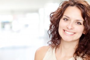 woman with red hair smiling