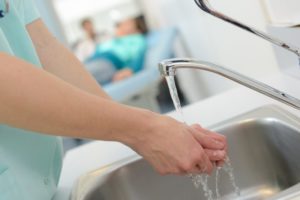 Dentist in State College washing hands