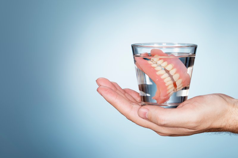 Dentures in glass of water