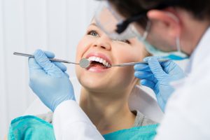 Woman receicing treatment from restorative dentist