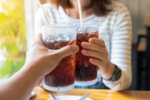 Couple drinking soda