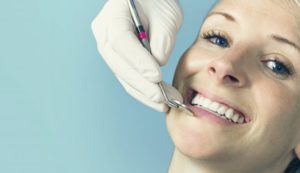 woman receiving cosmetic dental treatments in State College